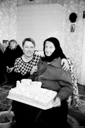 1a.Vjerka Presents Cake to Granny Prosja on Her 99th Birthday, Tsjerablichy, Jan. 14, 2017, 2017023-11A (63750011